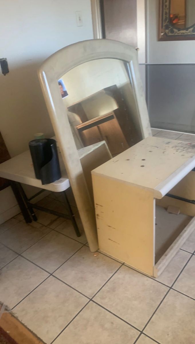 Old vanity mirror removed during a bathroom demo